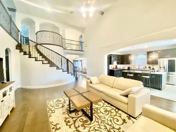 a living room with fireplace furniture and a flat screen tv