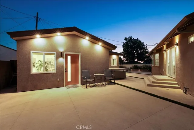 a view of a livingroom with furniture and floor to ceiling window
