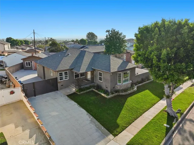 an aerial view of a house with a big yard