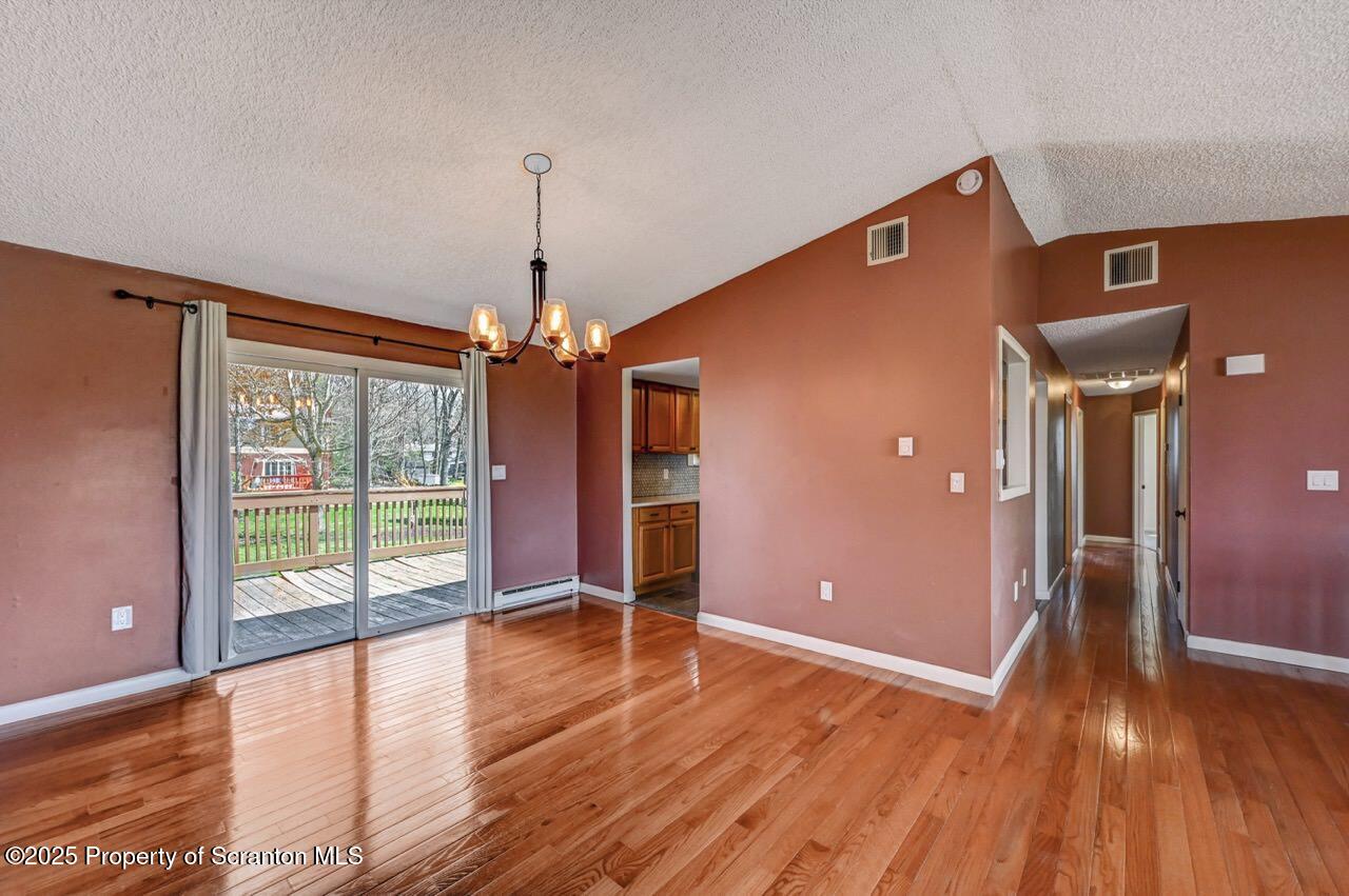 219 Noble Road Clarks Summit, PA 18411 - Photo 13 of 47 a view of empty room with wooden floor and fan