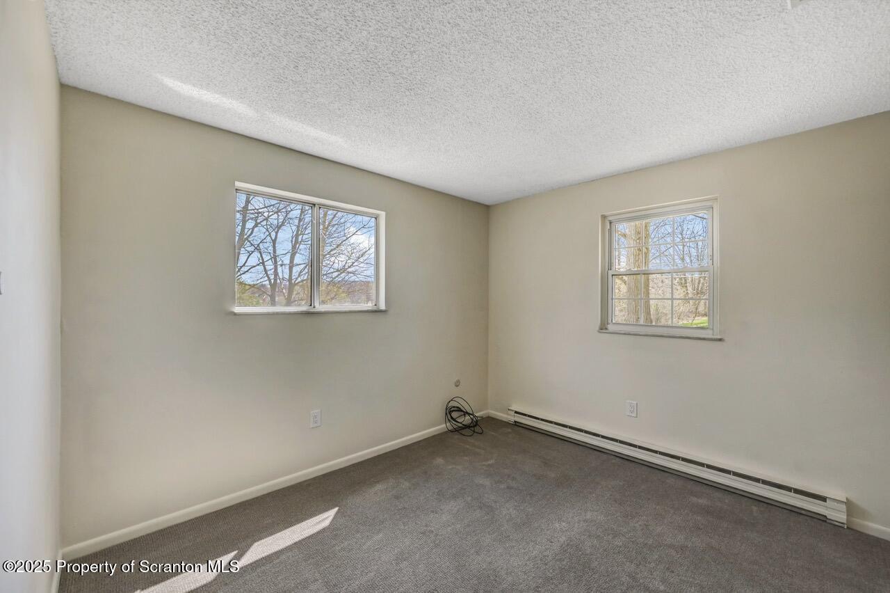 219 Noble Road Clarks Summit, PA 18411 - Photo 25 of 47 a view of an empty room with a window