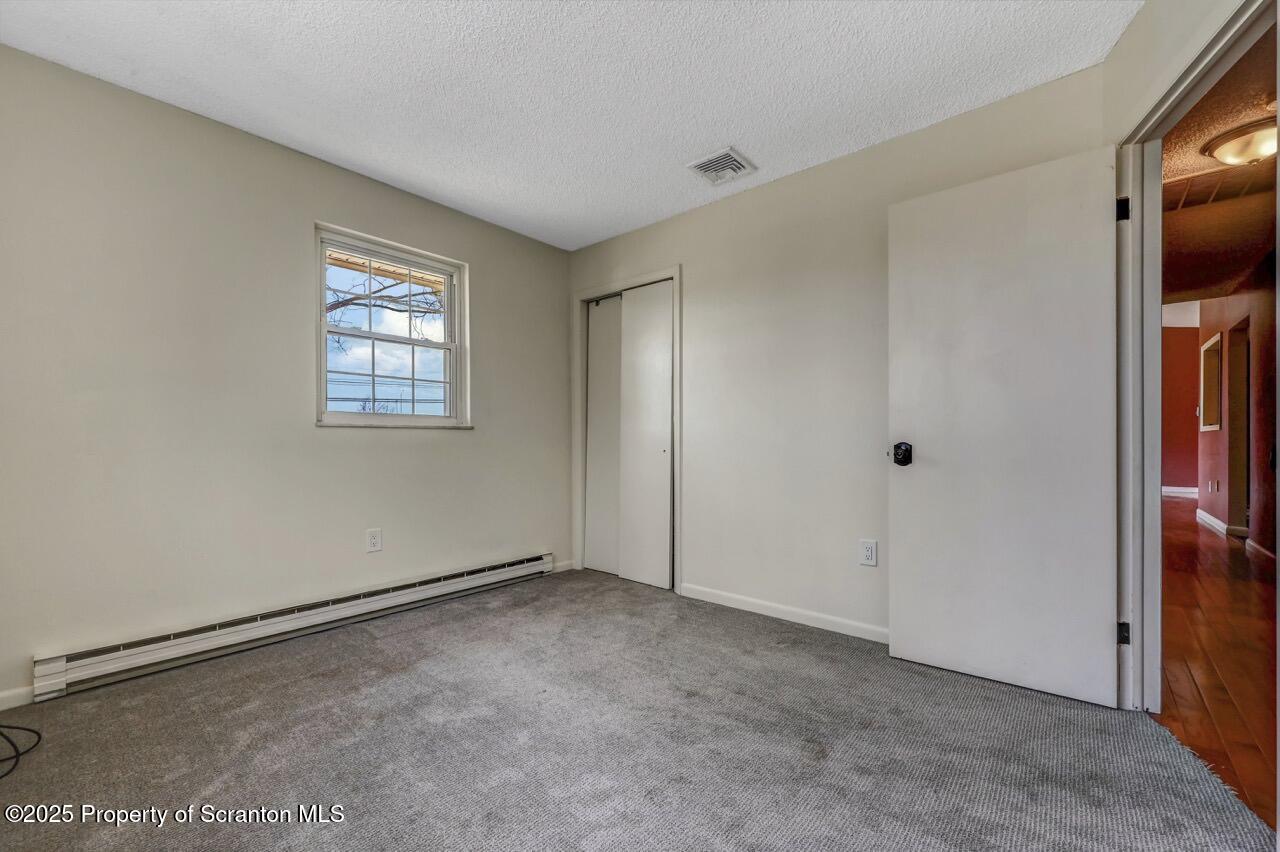 219 Noble Road Clarks Summit, PA 18411 - Photo 26 of 47 a view of an empty room with a window