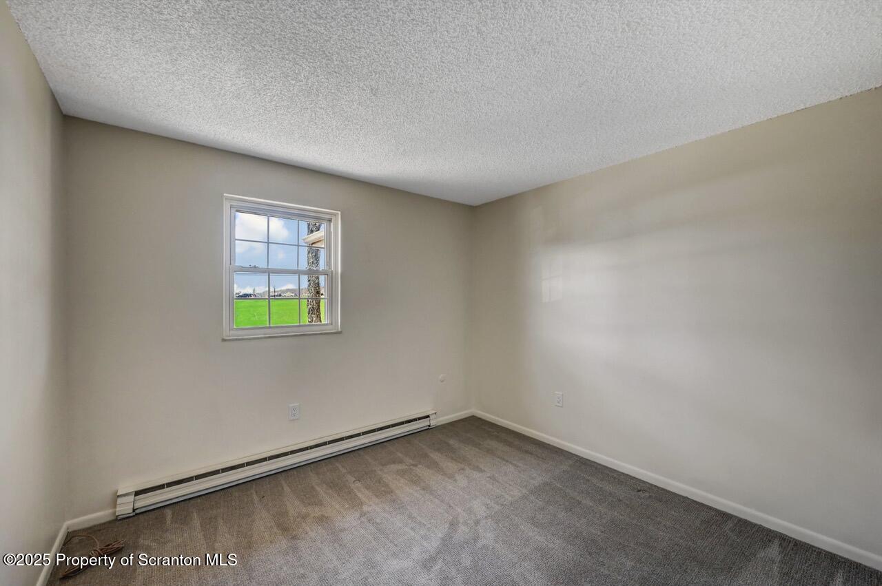 219 Noble Road Clarks Summit, PA 18411 - Photo 28 of 47 a view of an empty room and window with an entryway
