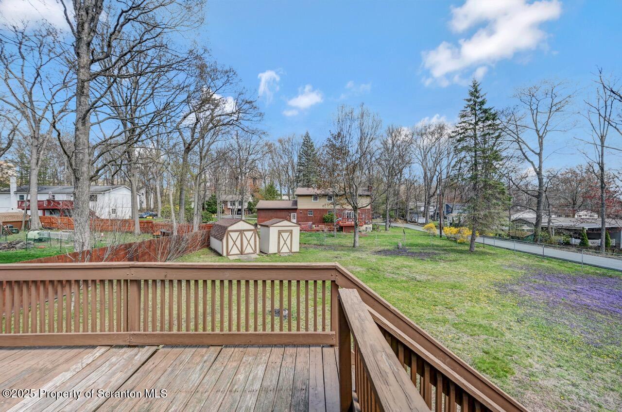 219 Noble Road Clarks Summit, PA 18411 - Photo 40 of 47 a view of a wooden deck with trees