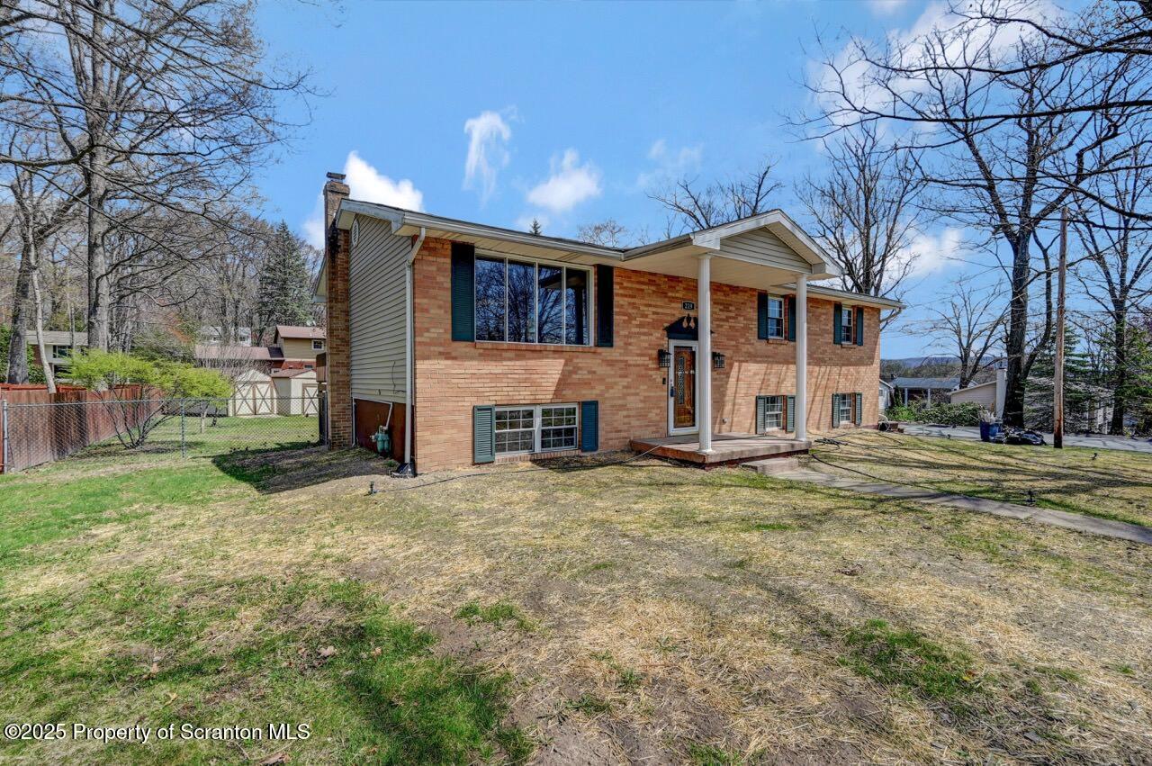 219 Noble Road Clarks Summit, PA 18411 - Photo 46 of 47 a front view of a house with a yard