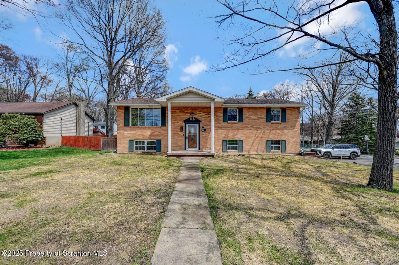 219 Noble Road Clarks Summit, PA 18411 - Photo 47 of 47 a front view of house with yard and trees around