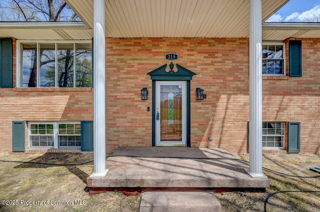 219 Noble Road Clarks Summit, PA 18411 - Photo 7 of 47 a front view of a house with a yard