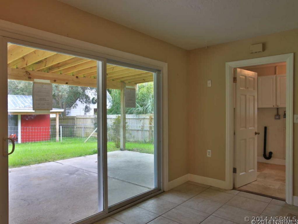 2738 Letha Road New Smyrna Beach, FL 32168 - Photo 16 of 21 a view of porch with a backyard
