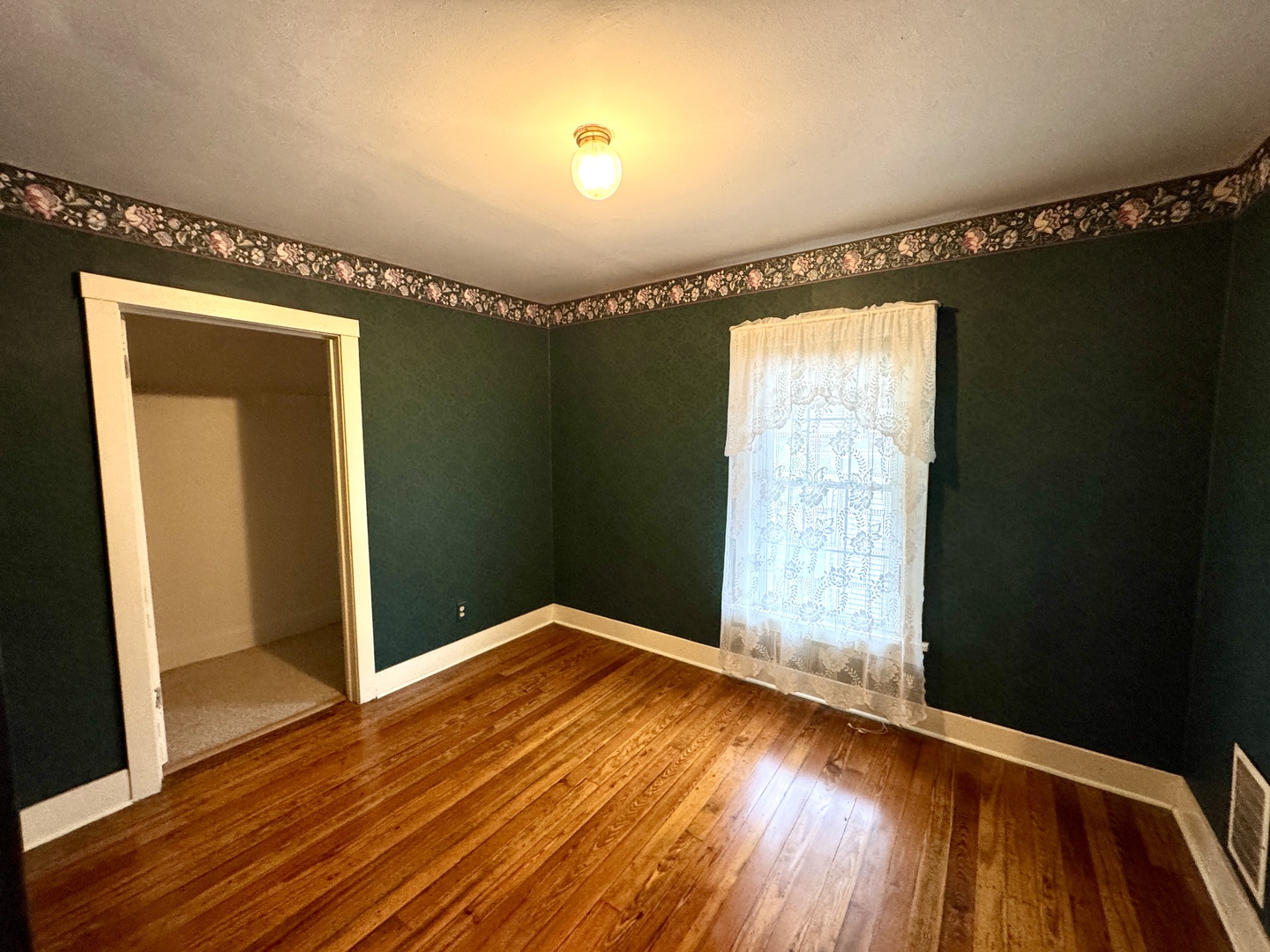 221 West Peru Street Princeton, IL 61356 - Photo 21 of 33 wooden floor in an empty room with a window