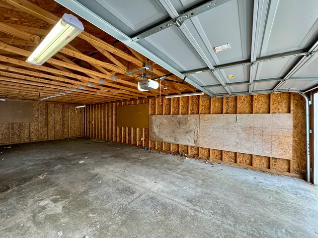 a view of a house with a yard and deck