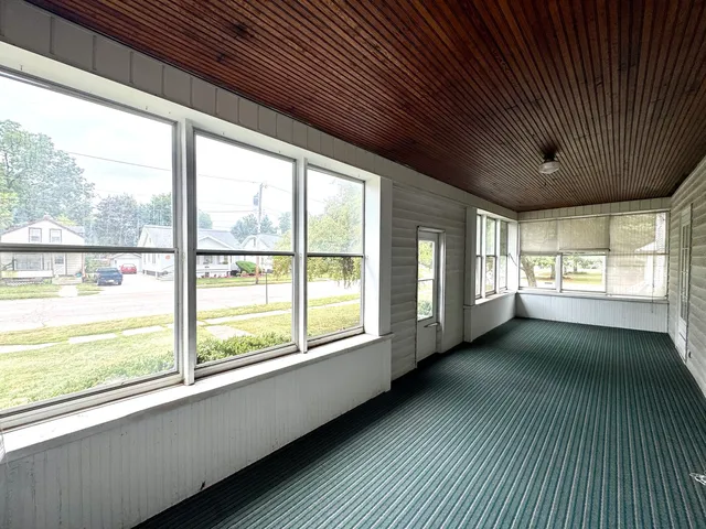 a view of an empty room with a large window