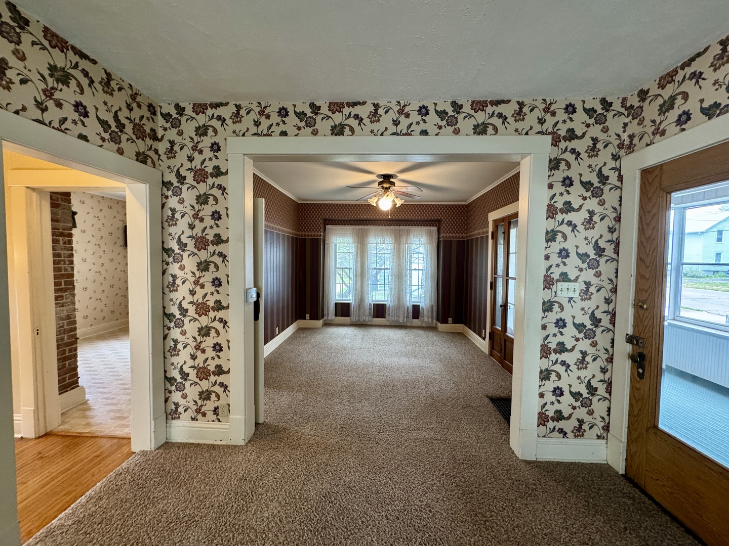 221 West Peru Street Princeton, IL 61356 - Photo 10 of 33 wooden floor in an empty room with a window