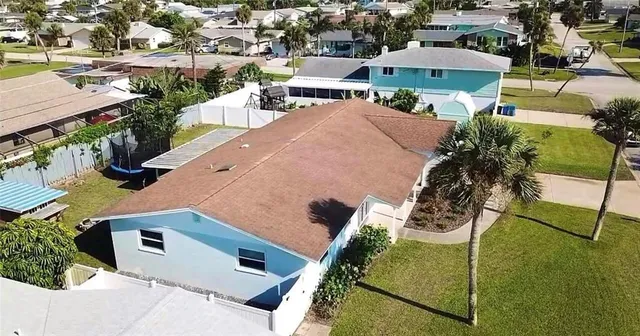 an aerial view of house with yard