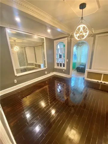a view of an entryway with wooden floor