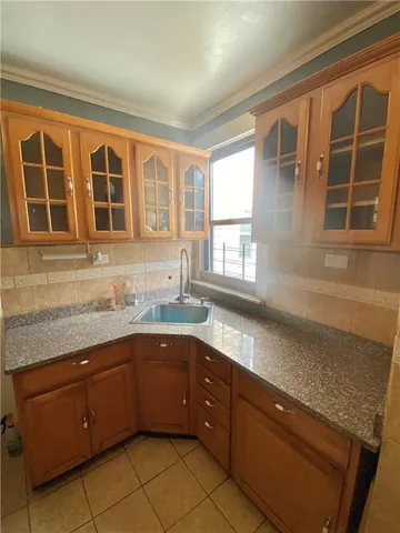 a kitchen with a sink and a window
