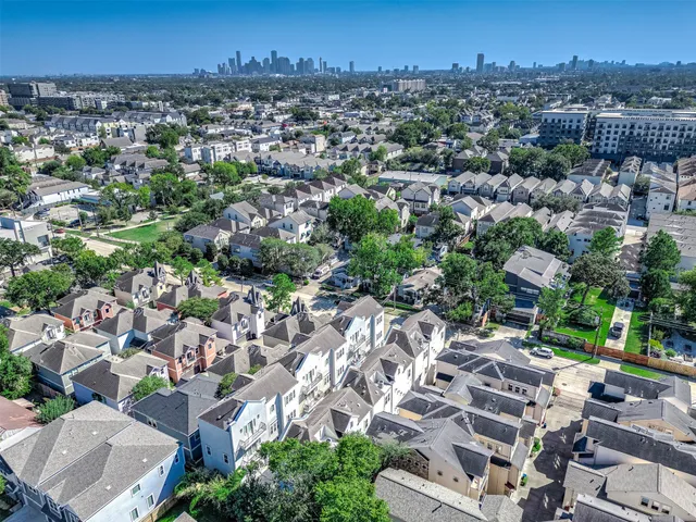 an aerial view of residential house with parking