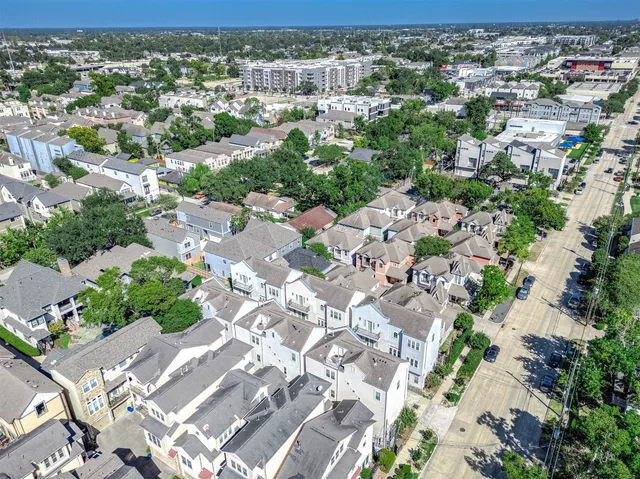 an aerial view of a city with lots of residential buildings