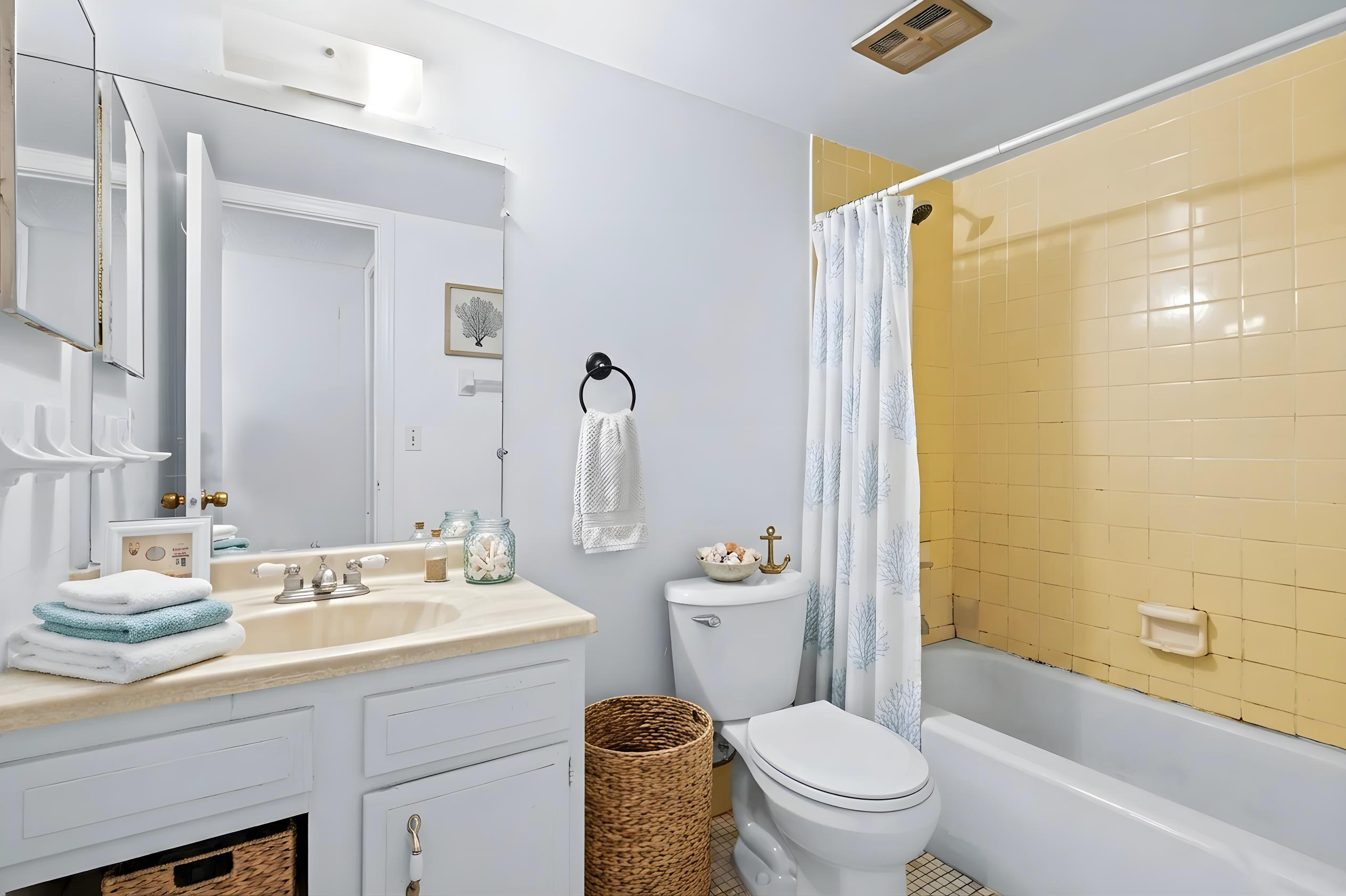 825 Northwest 13th Street, Unit 223 Boca Raton, FL 33486 - Photo 12 of 42 a bathroom with a sink a toilet a mirror and shower