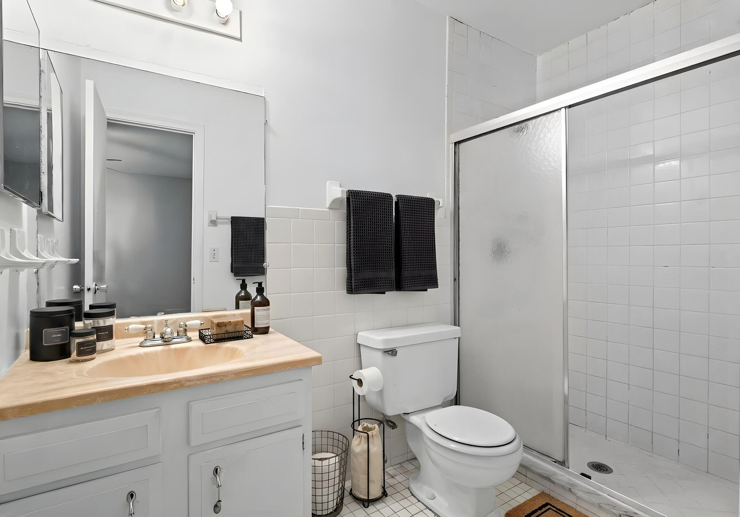 825 Northwest 13th Street, Unit 223 Boca Raton, FL 33486 - Photo 13 of 42 a bathroom with a toilet sink and shower