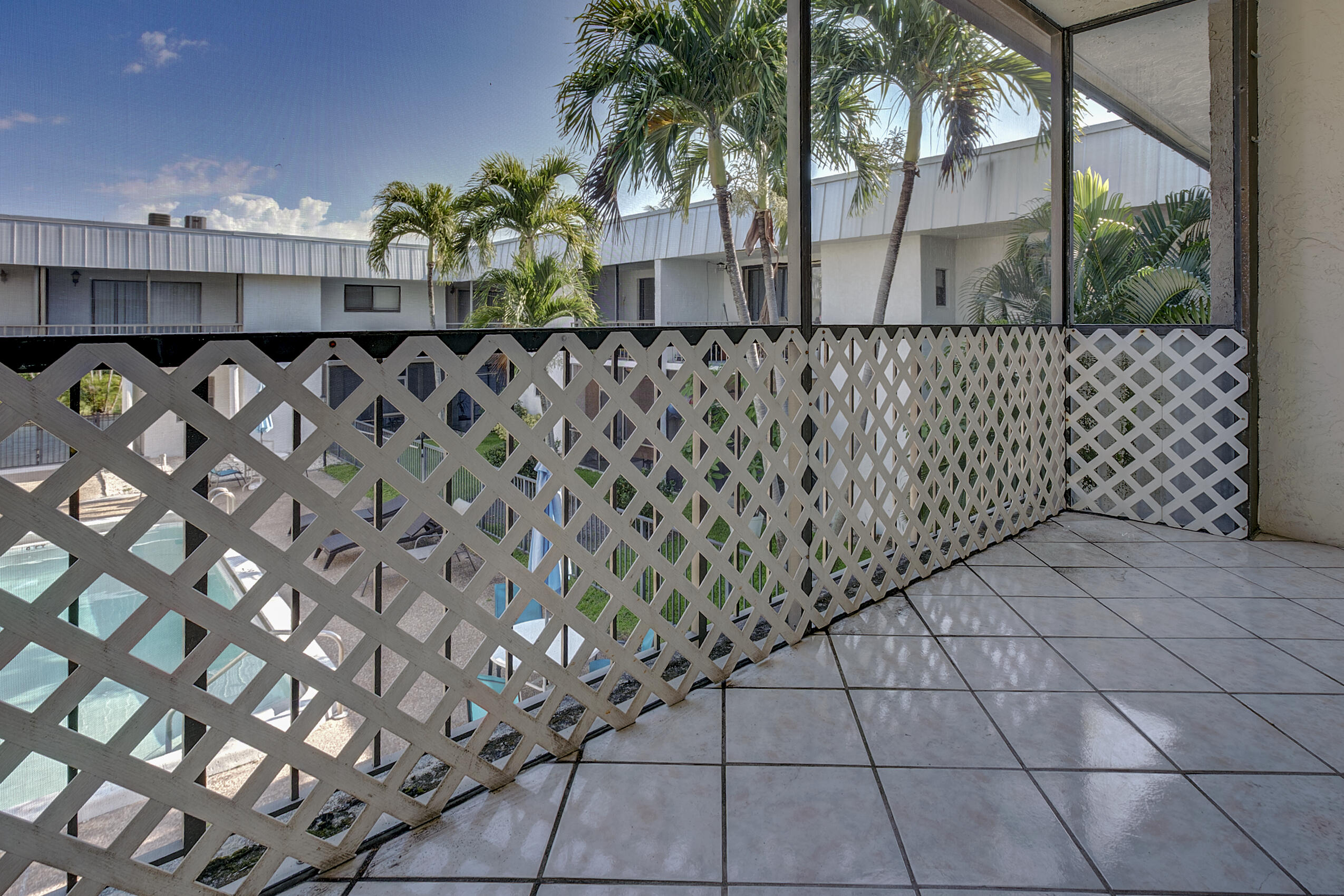 825 Northwest 13th Street, Unit 223 Boca Raton, FL 33486 - Photo 15 of 42 a couple of white wall with a potted plant