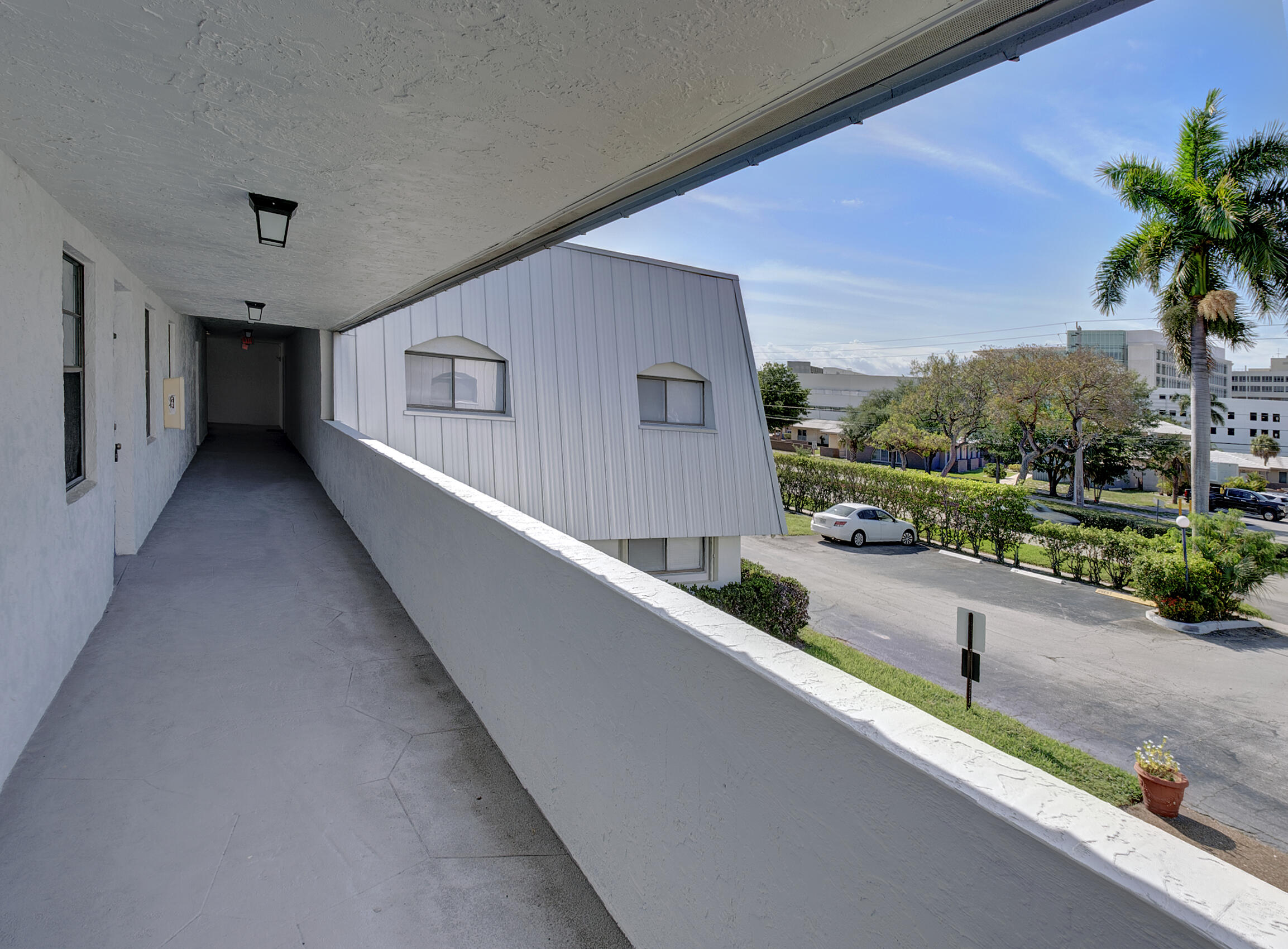 825 Northwest 13th Street, Unit 223 Boca Raton, FL 33486 - Photo 18 of 42 a view of a balcony with city view
