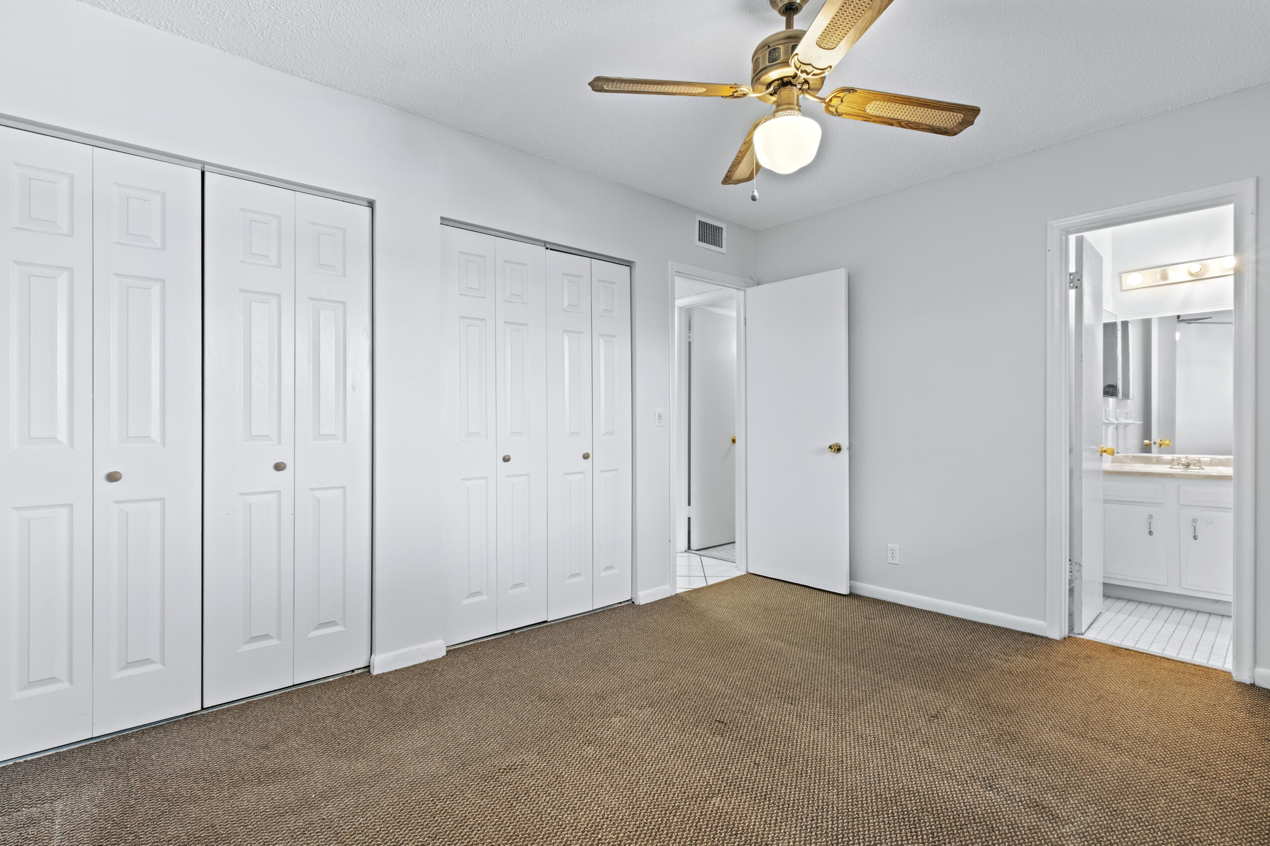 825 Northwest 13th Street, Unit 223 Boca Raton, FL 33486 - Photo 25 of 42 a view of empty room with ceiling fan
