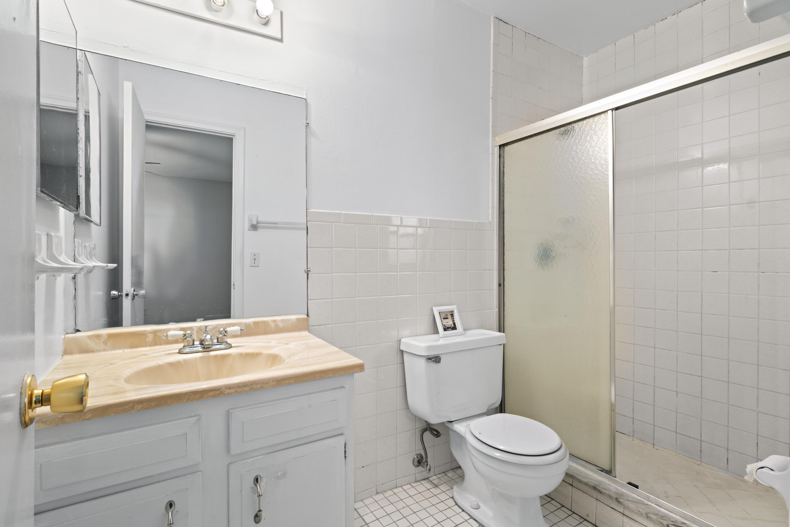 825 Northwest 13th Street, Unit 223 Boca Raton, FL 33486 - Photo 26 of 42 a bathroom with a sink toilet and shower