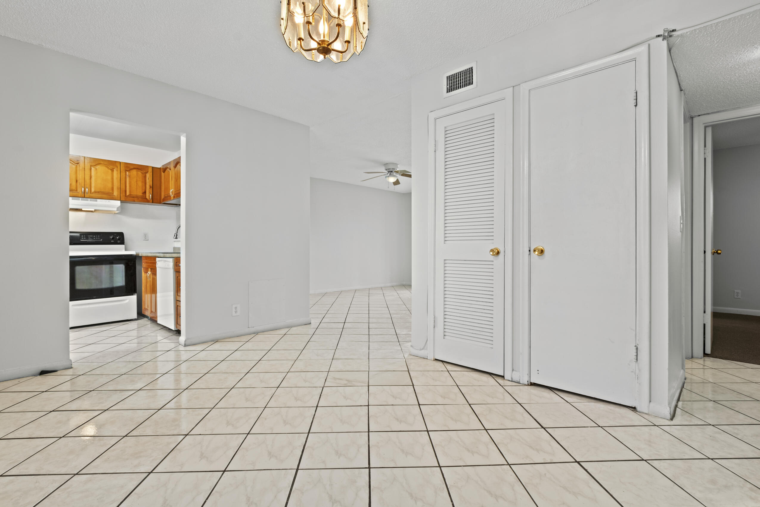 825 Northwest 13th Street, Unit 223 Boca Raton, FL 33486 - Photo 33 of 42 a view of a livingroom with an empty space and a window