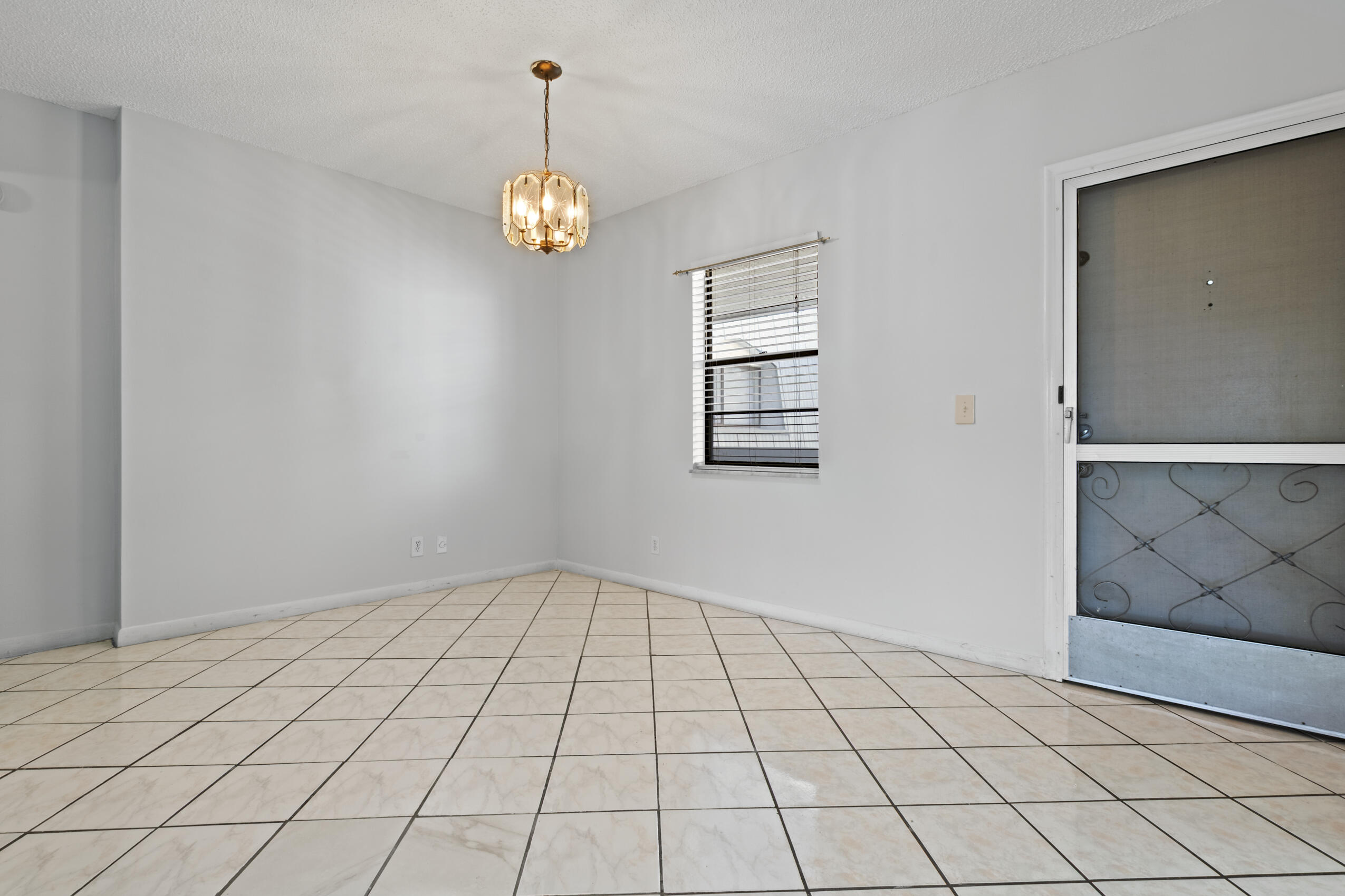 825 Northwest 13th Street, Unit 223 Boca Raton, FL 33486 - Photo 35 of 42 a view of an empty room with a window