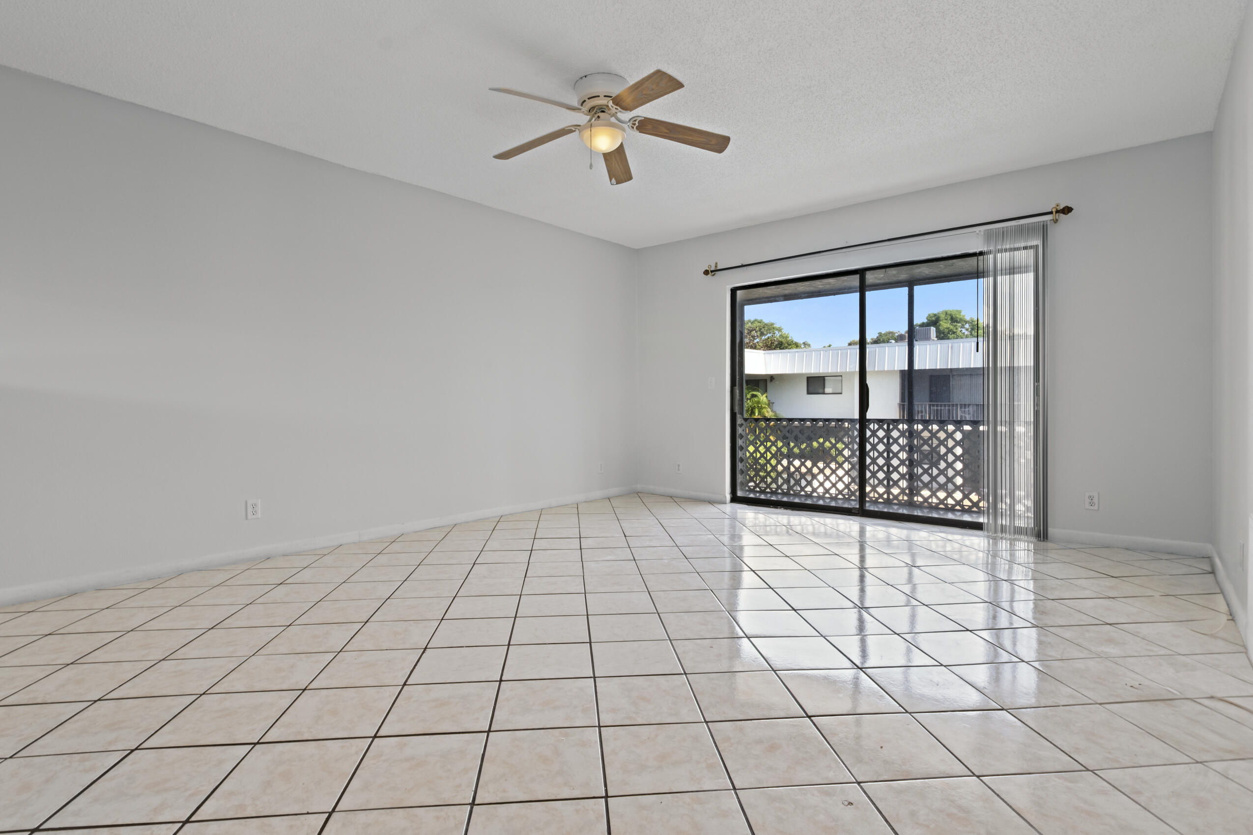 825 Northwest 13th Street, Unit 223 Boca Raton, FL 33486 - Photo 36 of 42 a view of an empty room and window
