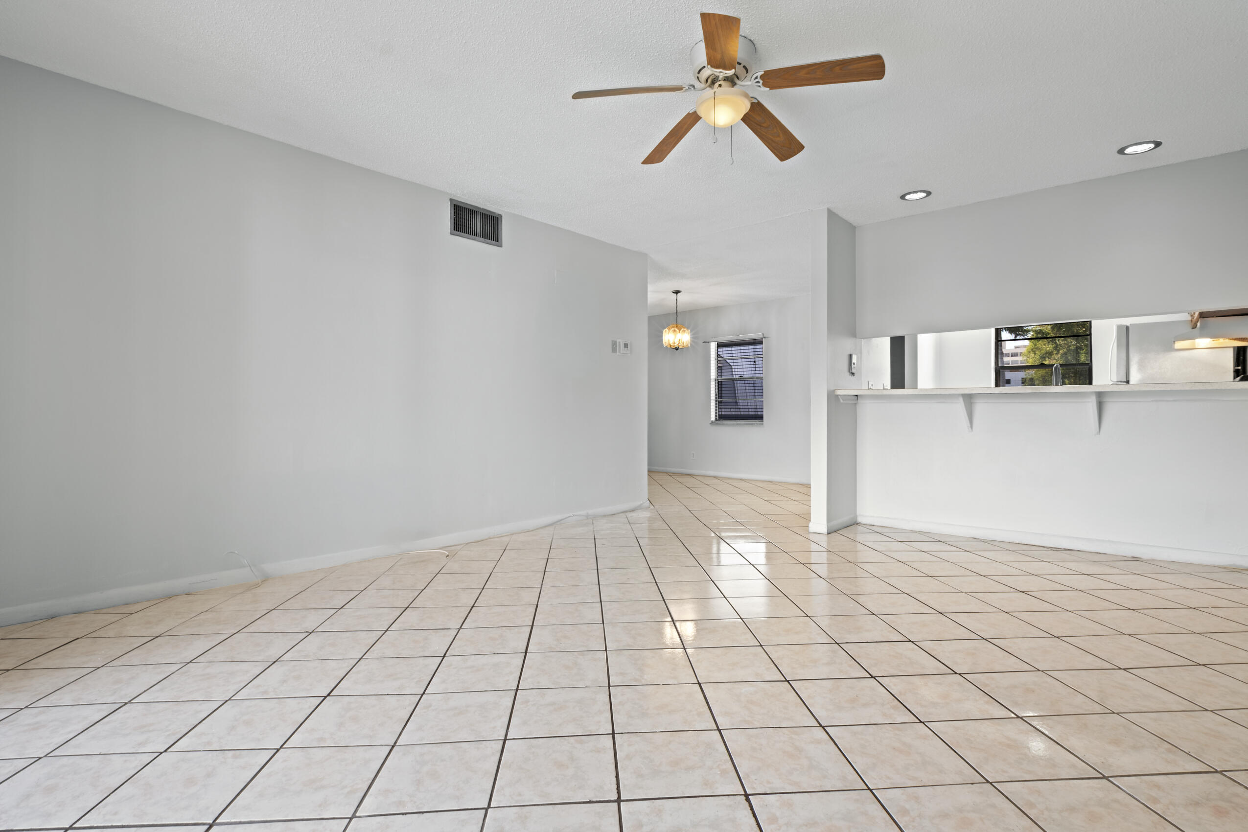 825 Northwest 13th Street, Unit 223 Boca Raton, FL 33486 - Photo 38 of 42 a view of an empty room and window