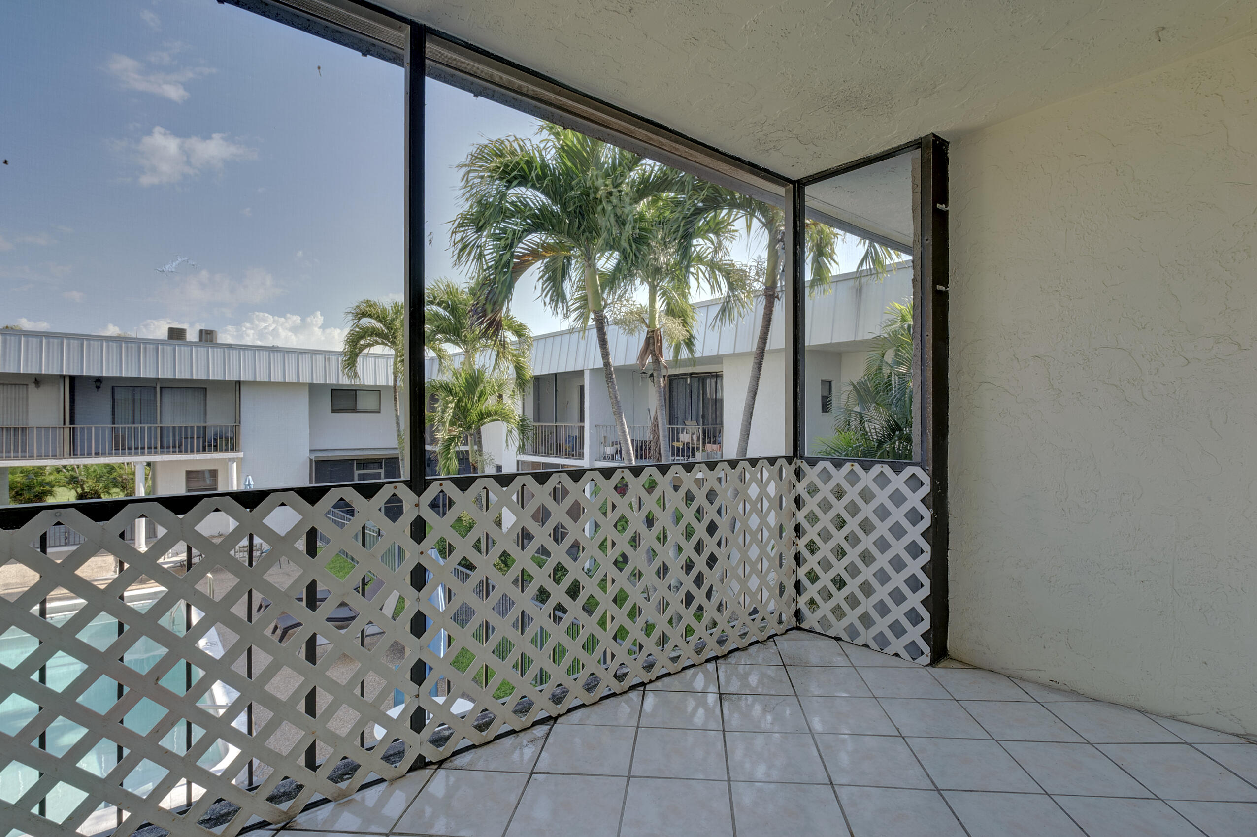825 Northwest 13th Street, Unit 223 Boca Raton, FL 33486 - Photo 4 of 42 a view of a garden