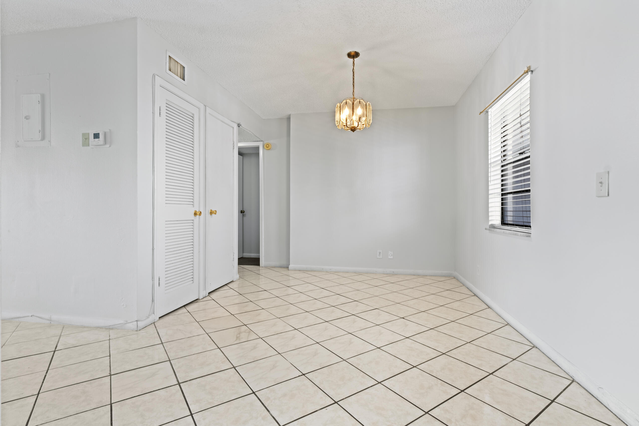 825 Northwest 13th Street, Unit 223 Boca Raton, FL 33486 - Photo 41 of 42 a view of an empty room and window