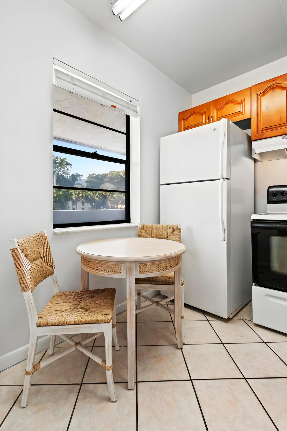 825 Northwest 13th Street, Unit 223 Boca Raton, FL 33486 - Photo 6 of 42 a dining room with a table and chairs