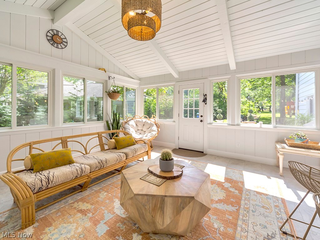 Fabulous four season room featuring vaulted ceiling, newer windows and door and newer minisplit