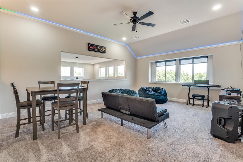 4810 Nomad Drive Midlothian, TX 76065 - Photo 17 of 39 a living room with furniture and a large window