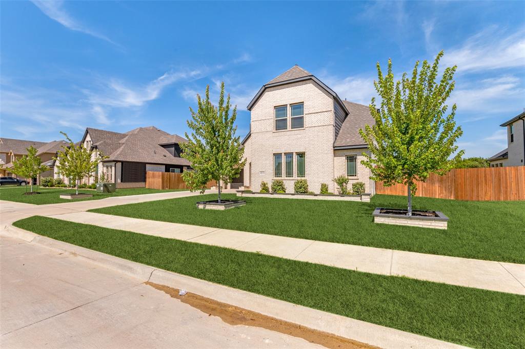4810 Nomad Drive Midlothian, TX 76065 - Photo 2 of 39 a front view of a house with a yard