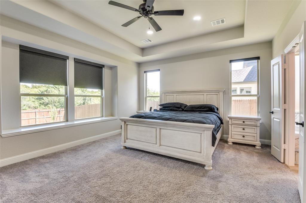 4810 Nomad Drive Midlothian, TX 76065 - Photo 23 of 39 a spacious bedroom with a bed and window