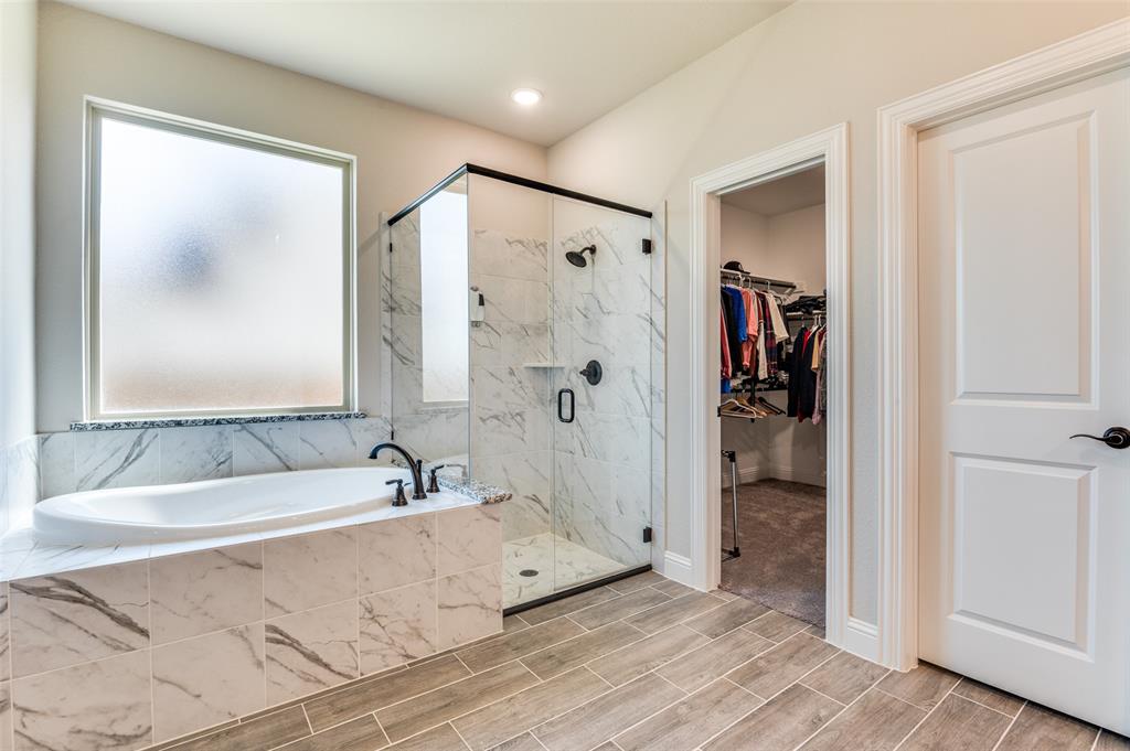 4810 Nomad Drive Midlothian, TX 76065 - Photo 25 of 39 a spacious bathroom with a tub and a shower