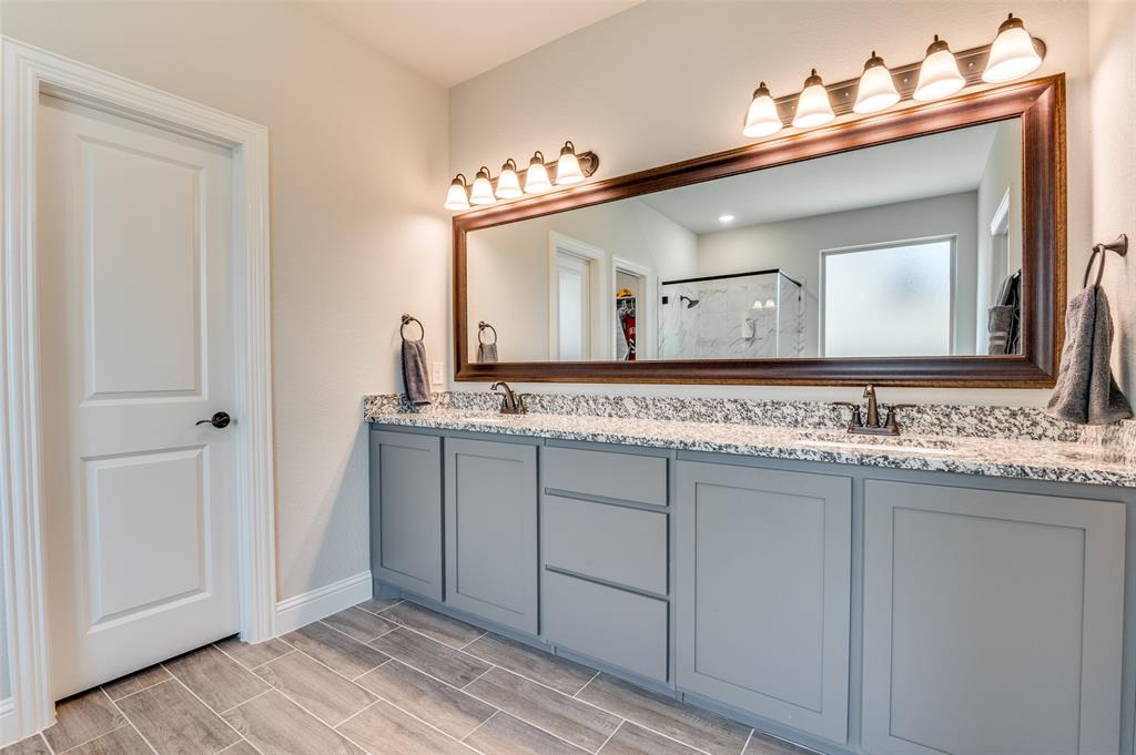 4810 Nomad Drive Midlothian, TX 76065 - Photo 26 of 39 a bathroom with a sink and a mirror