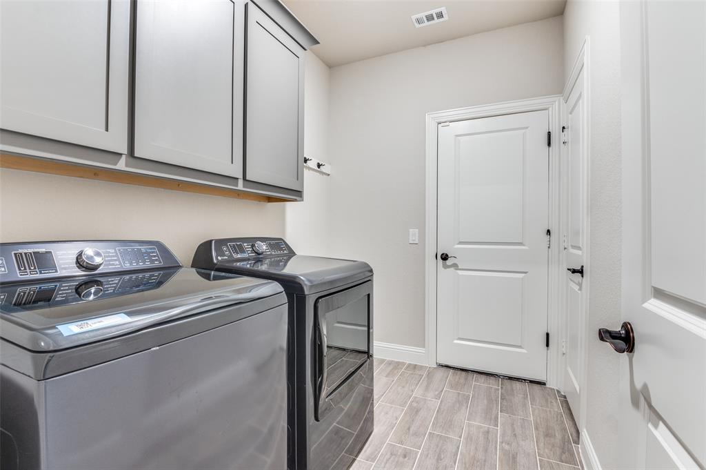 4810 Nomad Drive Midlothian, TX 76065 - Photo 31 of 39 a utility room with dryer and washer