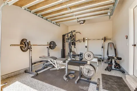 a bathroom with a granite countertop sink toilet vanity mirror bathtub and shower