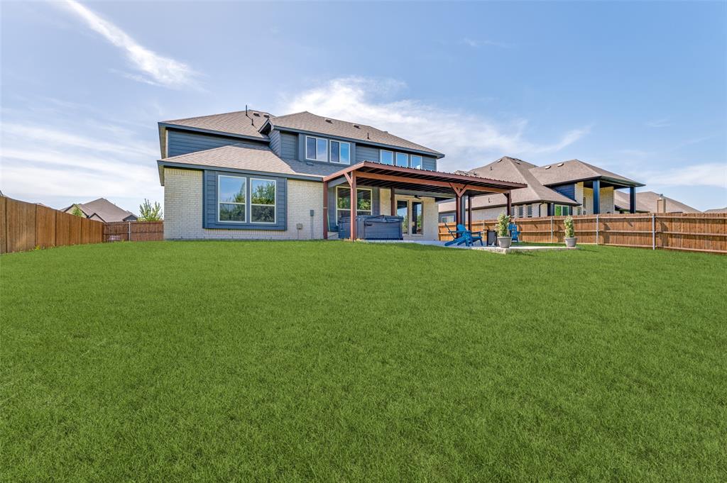 4810 Nomad Drive Midlothian, TX 76065 - Photo 38 of 39 a front view of a house with a garden and deck