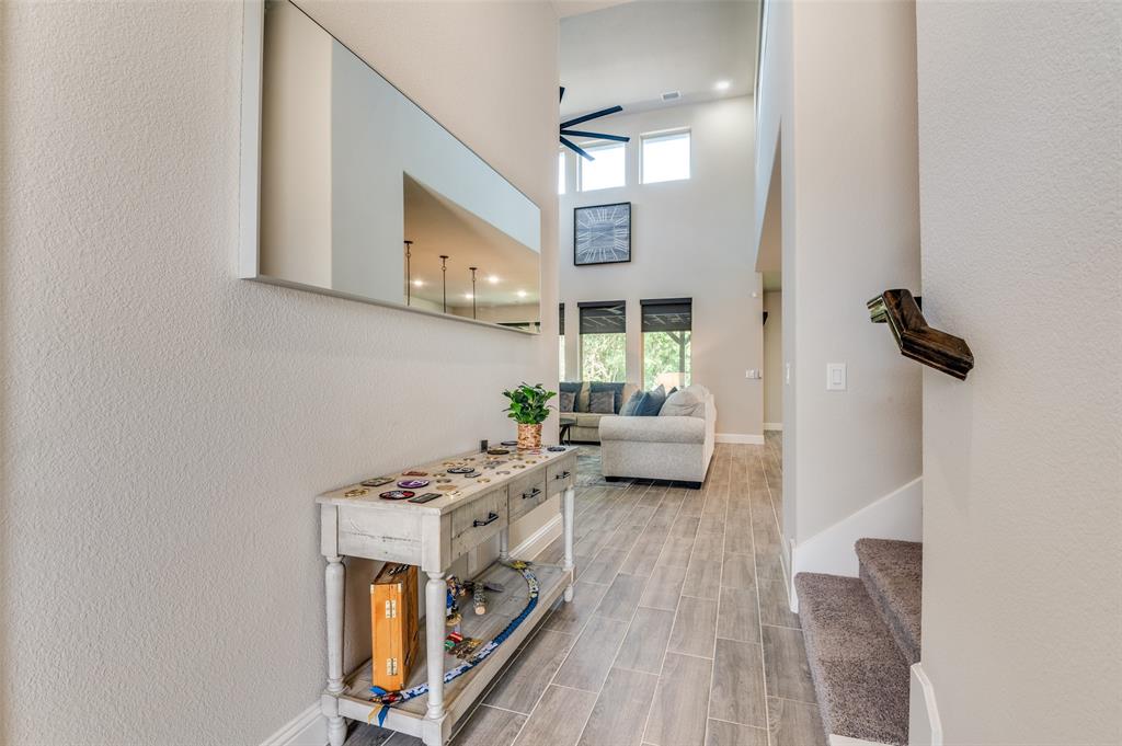 4810 Nomad Drive Midlothian, TX 76065 - Photo 4 of 39 a view of a livingroom with furniture and a floor to ceiling window