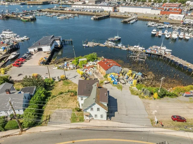 an aerial view of a houses with outdoor space