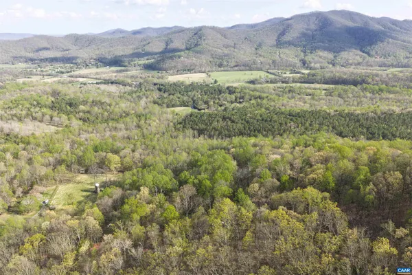a view of a mountain range with trees