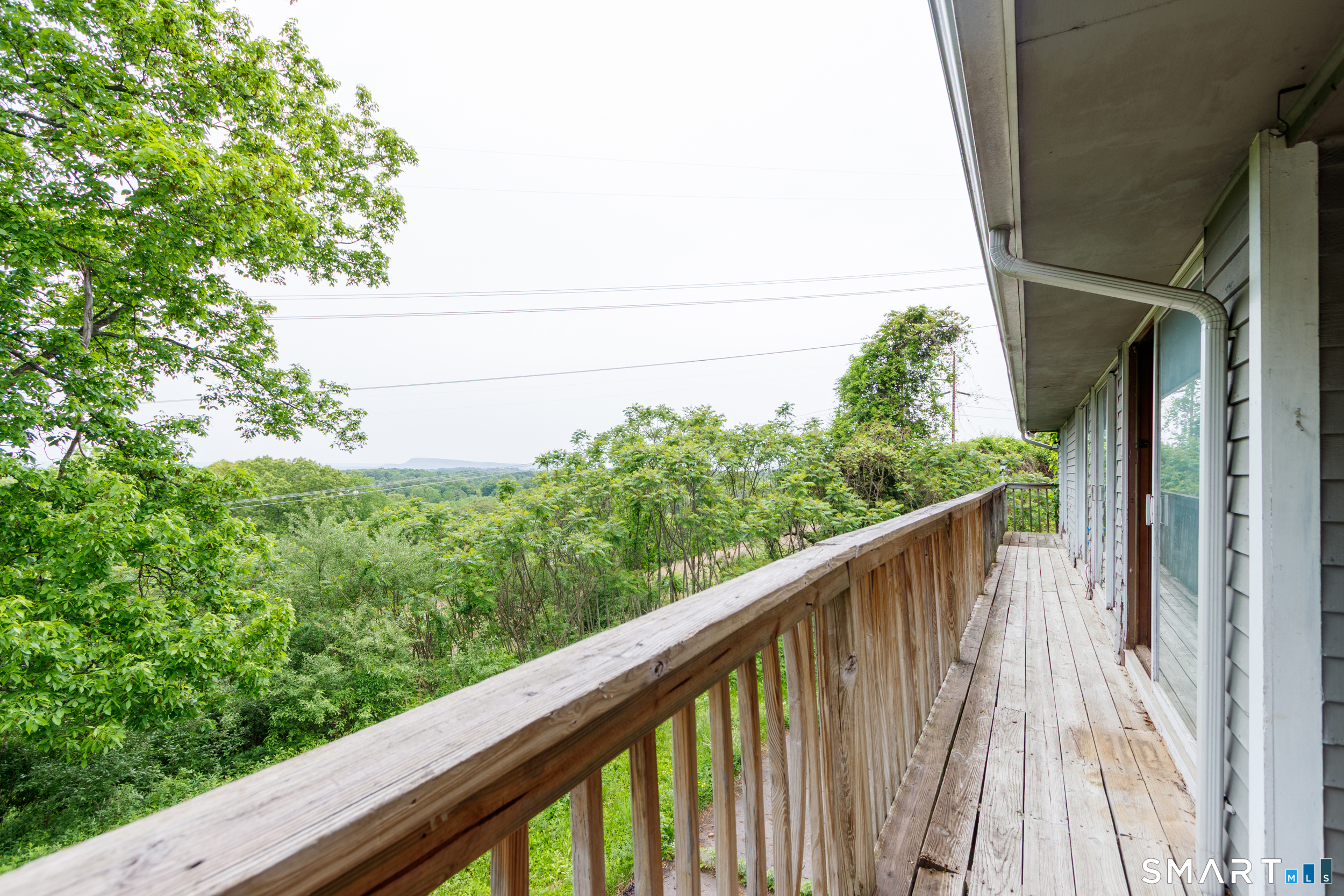 63 High Hill Road Wallingford, CT 06492 - Photo 6 of 34 a balcony with an outdoor space