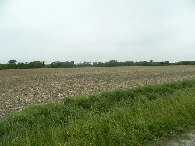 a view of a lake with houses in the back