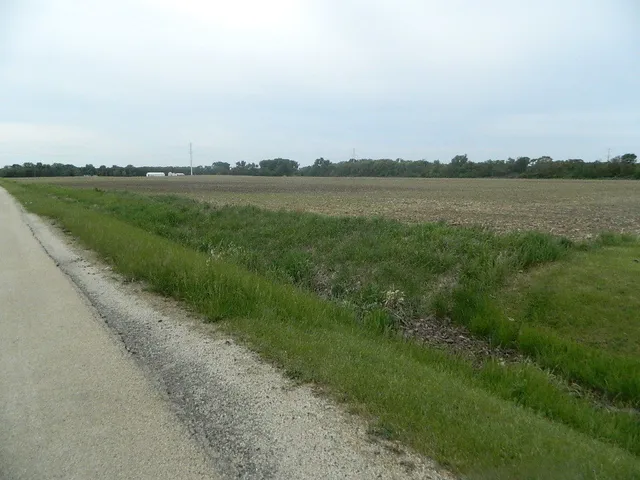 a view of a lake with a big yard