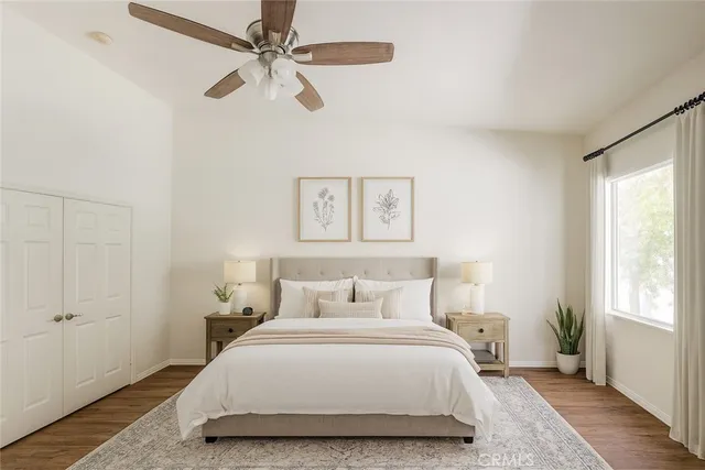 a bedroom with a bed and a window